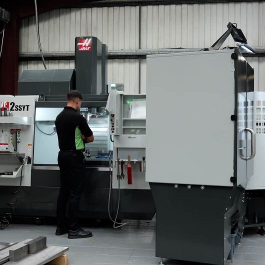 Engineer operating CNC machine for mould toolmaking at Crossen Engineering.